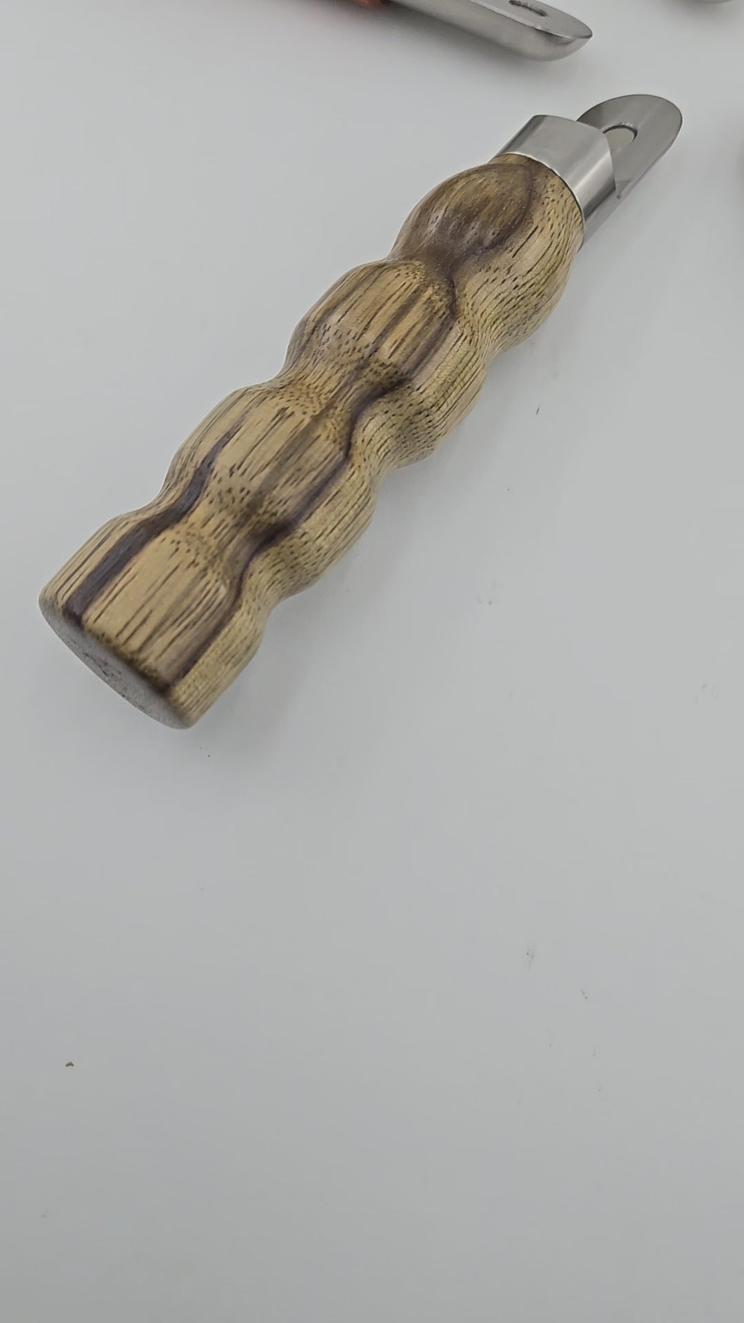 Five handmade no-dent bottle openers